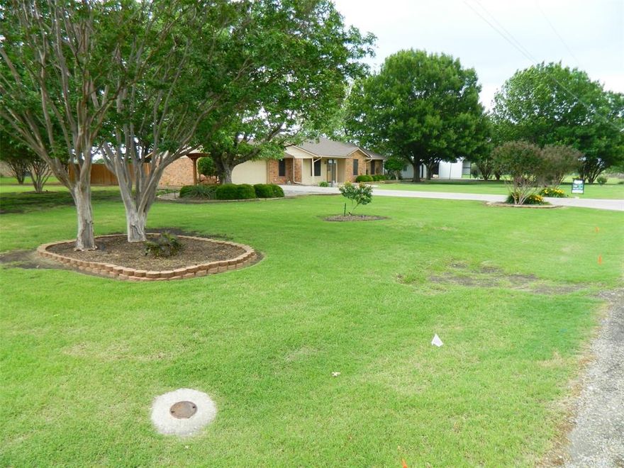 Discover a rare opportunity to own a spacious 4-bedroom, 3-bath home situated on a beautifully manicured 0.893-acre lot. This 2,160 sq ft home offers both comfort and open spaces, featuring a two-car attached garage, a stone patio perfect for relaxing or entertaining, and multiple outbuildings to meet a variety of needs.
The property includes an 18 x 10 steel-frame storage building, an additional 24 x 20 steel-frame shop, with electricity and water.
Originally built in 1985, the home has been updated to include a 576 sq ft primary bedroom suite, with walk in closet, an addition that created a second primary bedroom, or great for a mother-in-law suite. The foundation has been repaired in the past around the garage, and in June 2024, a new roof was installed using heavy-duty, impact-resistant Class 2 Tamko Heritage shingles for added durability and peace of mind.
Located in the welcoming community of Leonard, this home offers the best of country living while remaining conveniently close to everyday essentials such as shopping, dining, healthcare, and retail services. Leonard is known for its friendly atmosphere and strong school system, which just this year opened a new elementary school building, offering students a wide range of opportunities.
If you’re looking for space, functionality, and small town charm, this property is ready to welcome you home.