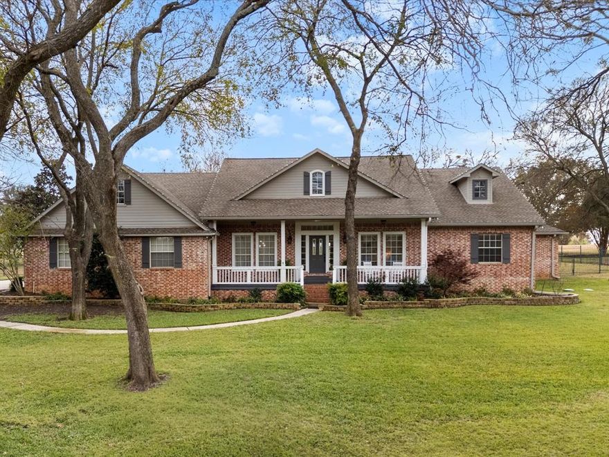 Set on a pristine 1-acre lot in the esteemed Hills of Argyle and within a top-rated school district, this custom Noble Classic Homes estate blends timeless American charm with elevated modern living. Tucked away on a quiet cul-de-sac, the residence showcases refined craftsmanship, a graceful and highly functional floor plan, and an impressive outdoor living environment complete with a built-in grill, resort-style pool, and spa—perfect for both everyday enjoyment and refined entertaining. Inside, the home features a chef’s kitchen with roll-out cabinetry and an induction cooktop, thoughtfully opening to the main living spaces for effortless flow. The serene primary suite offers an oversized bath with a tub-and-shower combination, while guest bedrooms—strategically separated for comfort and privacy—are complemented by well-appointed baths, including one with a large walk-in shower. Additional interior highlights include an upstairs media room, a private fitness space, and an oversized garage with exceptional storage capacity.
Outside, lush landscaping frames expansive areas ideal for recreation and gardening, including a large play-ready yard, mature plantings, and a generous garden with dedicated vegetable and herb sections. The property also benefits from an aerobic septic system, offering efficiency, environmental stewardship, and peace of mind. The quiet cul-de-sac setting provides minimal traffic and a welcoming neighborhood ambiance. A full list of updates and upgrades is available in the Transaction Desk documents. Information provided is deemed reliable but not guaranteed and should be independently verified. Buyer or Buyer’s Agent to verify measurements, schools, taxes, and all other information.
