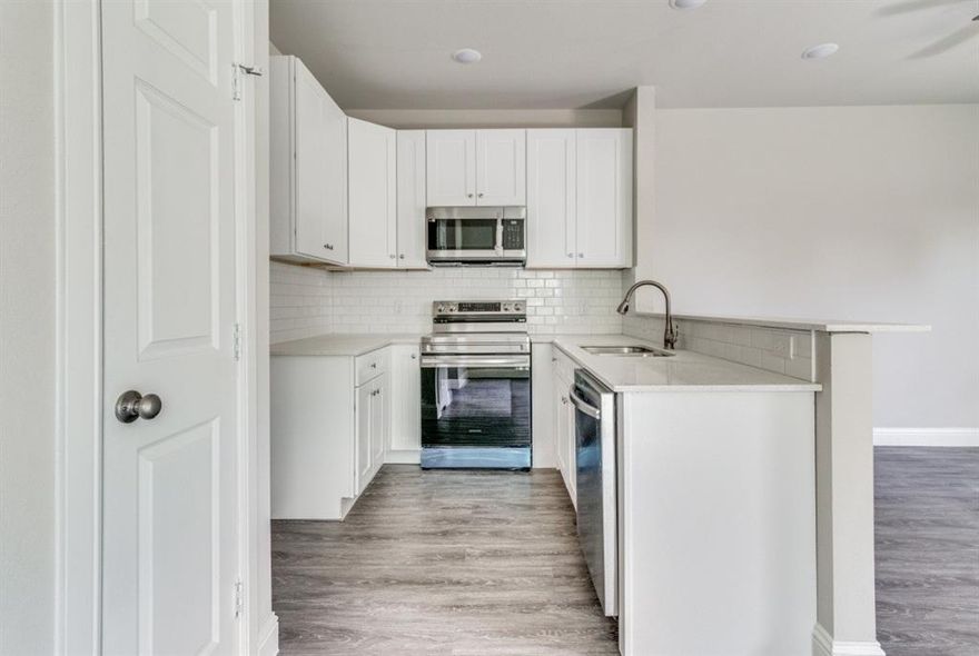 Stunning duplex with a spacious and practical floor plan. This two-story townhome boasts 3 upstairs bedrooms and 2.5 modern bathrooms. As you enter, you'll be greeted by a functional layout that features a living room and a well appointed kitchen. The layout is designed for seamless living with plenty of space to move around and socialize. The kitchen is fully equipped with top-of-the-line appliances, sleek countertops, cabinets and pantry that provide ample storage. The master bedroom has an en-suite bathroom. Additional features of this exceptional duplex include a convenient half bath on the main level, laundry upstairs, and a private backyard patio area, perfect for grilling or relaxing. Situated in a prime location, this property boasts high-end finishes and a modern design, making it a must-see for anyone looking for a stylish and comfortable home.