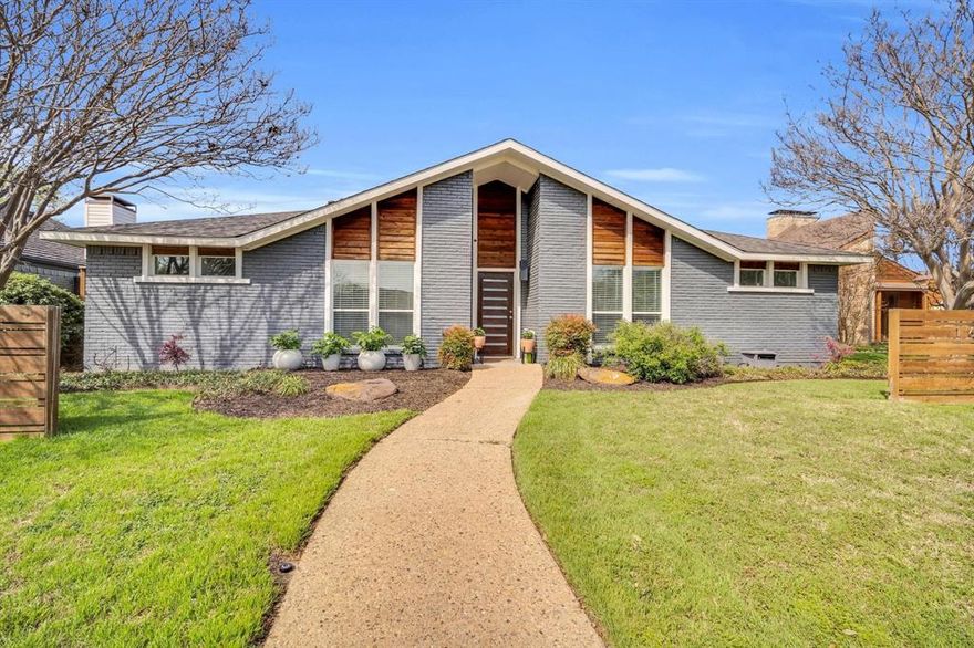 Remodeled and thoughtfully reimagined, this modern retreat is a standout opportunity in highly sought-after Preston Port Estates, zoned to acclaimed Brentfield Elementary in Richardson ISD. Offering 3 bedrooms, 2.5 baths, plus a separate office or guest room with a Murphy bed that conveys, this home blends mid-century charm with elevated, contemporary design in a way today’s buyers crave. From the moment you arrive, the curb appeal makes an impression with sleek modern wood accents and fresh landscaping. Inside, a light-filled, open floor plan welcomes you with a stunning wall of windows overlooking a private courtyard-style patio, creating a seamless indoor-outdoor connection. The living room is anchored by a dramatic floor-to-ceiling fireplace, complemented by a wet bar - perfect for effortless entertaining. The chef’s kitchen is both functional and beautiful, featuring custom cabinetry, granite and quartz surfaces, stainless steel appliances, a 6-burner gas cooktop, and a peninsula with additional seating, plus a bright breakfast nook for casual dining. The primary suite offers a peaceful retreat with dual vanities, separate closets, and a spa-inspired bath with floor-to-ceiling tile and walk-in shower. Two secondary bedrooms share an updated bath, while the dedicated office or flexible space for guests, work, or play. Step outside to enjoy exceptional outdoor living with a covered patio strung with twinkle lights - ideal for evening dinners, entertaining, or simply unwinding. The expansive grassy backyard offers plenty of room for kids to play or pets to roam. Additional highlights include light flooring throughout, 2023 roof, and fully paid-off solar panels. Perfectly positioned near major highways, shopping, dining, and entertainment, and feeding into Brentfield Elementary, Parkhill Junior High, and J.J. Pearce High School, this home offers the ideal combination of location, lifestyle, and design.