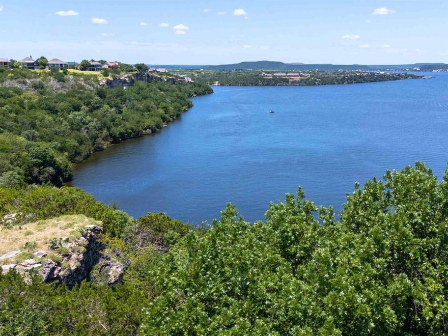 PANORAMIC LAKE FRONT VIEWS OF POSSUM KINGDOM LAKE!! OWNER FINANCING AVAILABLE!! Build your dream waterfront weekend getaway or full-time home on this stunning property perched high above the lake inside the prestigious Cliffs Resort community, boasting unparalleled panoramic views of Possum Kingdom Lake. Lot 11 is a cul-de-sac lot which offers a wider backyard looking out over the lake.  This premier location combines natural beauty with refined resort living. Enjoy tranquil evening walks to the nearby on-site restaurant, just a short distance away. Surrounded by a championship golf course, this property is the ideal retreat for both golf enthusiasts and nature lovers alike.