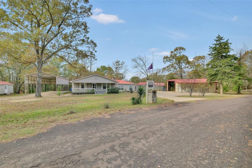 Discover cute country farm house living, complete with covered front porch, on 3 lots (2 parcels), at Lake Fork and Glade Water Creek! It's lake front and heavily treed with outdoor living, fishing pier, and BRAND NEW separate GUEST QUARTERS (completed 12-2025 and not included in square footage). Large workshop or garage with electric & 5th wheel parking. 60 foot long pad with cover that will accommodate your semi trailer truck. Glass enclosed sunroom with hot tub and the most beautiful view! Outdoor shower with hot & cold. Outdoor kitchen with cabinets of the strongest wood (Cypress), granite counters, propane burner, & real stone fireplace. Covered composite deck never needs staining or sealing. Stamped and stained concrete patio. Large storage building. NEW LVP FLOORING in upper level of main house (11-2025). Newer SS appliances in kitchen. Sound system zoned throughout the house. Looking for country living with bass fishing and recreation, or just a home away from home? Less than 10 mins from the cutest little downtown with a corner store, school, bank, & post office...less than 20 mins from shopping and dining in Sulphur Springs. East of Dallas. Come see!