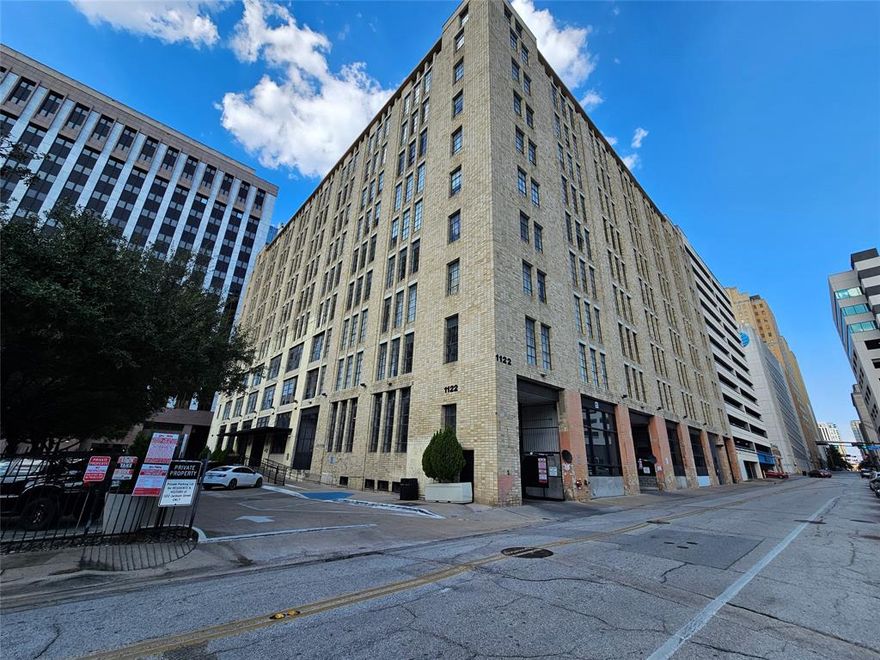 Experience vibrant Downtown Dallas living in this stylish efficiency condo on the 9th floor of one of the historic Santa Fe Buildings. This all-electric unit features an industrial modern look with concrete floors, built-in cabinetry, and includes a washer, dryer, and refrigerator. Enjoy free, assigned parking in a secure garage, plus high-speed AT&T internet (just bring your own modem), and water, sewer, and trash all included in the rent.

Residents have access to a community pool with grill area, media room, and fitness center, offering a complete urban lifestyle. The landlord pays the HOA fee, which covers all utilities except electric, and the home includes one reserved garage space for added convenience. Live just moments from the Kay Bailey Hutchison Convention Center, historic Dallas landmarks, and the heart of Downtown—where history, style, and modern comfort come together. HOA Pet friendly rules apply with nonrefundable deposit. Move in special.