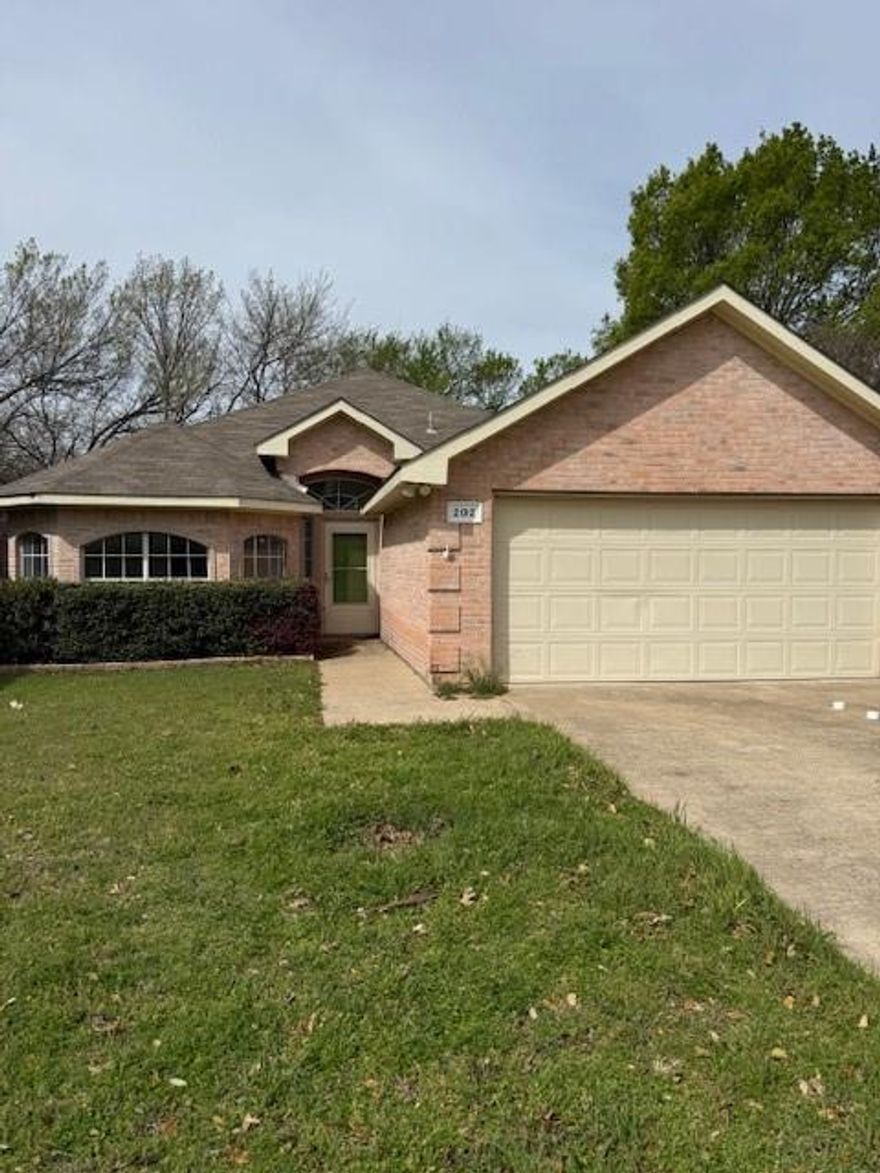 Charming 3 bedroom, 2 bath single family home in Waterford Oaks Garden Homes in Cedar Hill. Features an open-concept living area with fireplace, spacious primary suite with walk-in closet and private bath, and two additional bedrooms with a shared full bath. Brick exterior, 2 car garage, and low maintenance yard on an interior lot. Conveniently located near shopping, dining, and Cedar Hill ISD schools.