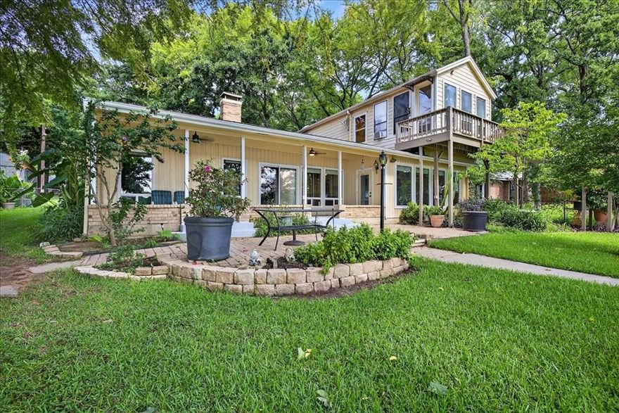 Lakefront paradise awaits! Embrace the ultimate lake lifestyle in this meticulously maintained home, perfectly positioned to capture refreshing easterly breezes. Enjoy stunning gardens, mature shade, and lush grounds.  The waterfront is a boater's dream with over 6' water depth, steel retaining wall with sidewalk and a single-slip boathouse with double PWC lift. Ample parking includes an attached two-car garage plus an oversized detached two-car garage – perfect for a shop or he-she shed!  Inside, lake views abound from the well-kept interior. Two private en-suite bedrooms offer guest comfort, and the open kitchen flows effortlessly into the family and dining areas.  Located in a quiet neighborhood, this home is just an hour from DFW with easy access to shopping, dining, and healthcare. It’s the perfect spot for weekend retreats or year-round lake enjoyment!