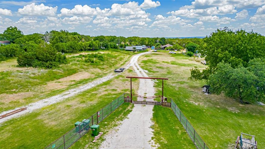 19 Acres – Endless Possibilities in Azle ISD! No Restrictions! MOBILE HOMES OK! BANDOS- OK! DEVELOP THIS INTO A MOBILE HOME PARK! MAKE IT AN RV PARK! DREAM IT AND BUILD IT! COMMERCIAL - OK! BUY IT AND BUILD IT TODAY! Incredible opportunity to own 19+ peaceful, picturesque acres in Azle ISD with no restrictions! This stunning property offers privacy, natural beauty, and unmatched versatility — whether you're looking to build your dream home, start a commercial venture, develop a tiny home or RV park, or create a private retreat.
Enjoy star-filled skies, mature trees, and a serene setting with a large approximately 2-acre pond and seasonal creek. The land features multiple access points and extensive road frontage on Tenderfoot Trail — all outside the floodplain. Ideal for livestock, horses, farming, or multi use development: Main Features Include: Double-wide mobile home approximately 2,400 sq ft, with 3BR & 1BA, large living area with wood-burning stove, oversized kitchen, full laundry room, office, and covered porches, 42 solar panels, newer roof, central HVAC
Land includes 2 septic systems, 1 well, and 5 RV hookups. AG exemption on majority of the land, main house sits on 1 acre, not AG exempt
 Multiple outbuildings: metal garage with 3 roll-up doors & electric, 750 sq ft rental home, greenhouse, storage buildings. Horses and livestock permitted. No zoning or deed restrictions – perfect for commercial use, mobile home park, tiny home community, truck parking, or nonprofit retreat
Endless opportunities await on this rare, unrestricted property. Bring your imagination and make it your own! Multiple parcel IDs. All structures sold AS-IS, no warranties or representations. Owner is not interested in dividing the property. Any buyer will need to purchase first and then divide it after closing. No owner carry.