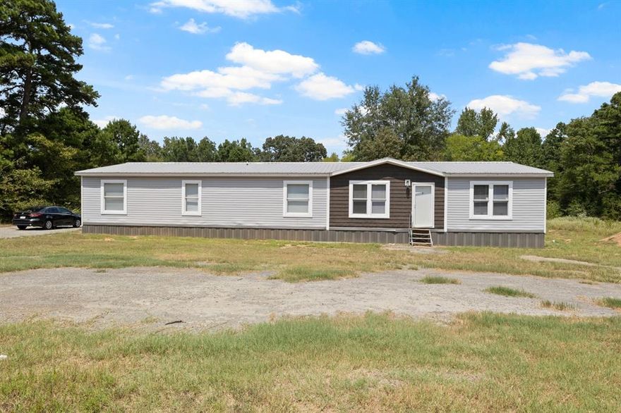 Nestled on the outskirts of town, this meticulously crafted home is a haven for gathering and entertaining. Featuring 2spacious living areas and an expansive kitchen equipped with multiple dining spaces, this property is an entertainer's dream. The chef's kitchen is a culinary delight, complete with a breakfast bar, small island, ample cabinetry, and a cozy eat-in space with built-ins for added convenience. The oversized primary suite offers a peaceful escape with a luxurious ensuite bath showcasing a soaking tub, dual sinks, and a separate shower. Hosting guests is a breeze with 3 guest rooms, two of which feature ensuite baths, along with a convenient hall bath. The expansive backyard provides the perfect setting for relaxation, while the workshop with electric is a great space for hobbyists. No restrictions! Don't miss out on this exceptional property.