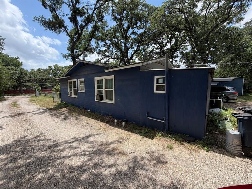 Very unique opportunity to own .6 acre lot with 3 buildings. The main house is a 2-bed 2-bath home; there is an additional detached garage that has been converted into a 1-bed 1-bath apartment that could be great for a number of different set-ups. Property is being sold AS-IS.