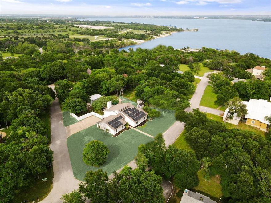 BACK ON MARKET WITH EVEN MORE UPDATES!! Bathrooms recently updated with Luxury Vinyl Plank Flooring & Kitchen has new Pendant Lights & Kohler Faucet.  Welcome to your own private paradise on this large over .5 acre estate with Benbrook Lake just down the street.  Home is built on a Double Lot.  It's like living in a private reserve with deer & rabbits roaming the area, lots of trees, winding roads & Lake with in site of the home. Country living with near by city amenities. This home features Solar Panels that are paid in full & free & clear that convey with the home saving you on electric costs, upgraded electrical, New Top of the Line Sand Filtration System for Pool, New Section of White Fence, High Quality Bosh Refrigerator that stays, and Garage door overhauled, all moving parts were replaced. The kitchen is open to the Living Room with Granite Counter Tops and recently refinished tops in a Modern Kitchen setting ready for all of your culinary needs. The home has an Open Concept Layout, Vaulted Ceilings in the Living Room, specialty lighting, Luxury Vinyl Plank Flooring, New Carpets in the Bedrooms, Stairs and Loft area, a wood burning fireplace & the Loft area that could be used as a Game Room, Second Living Room, 4th Loft type Bedroom with a full sized bathroom, or Home Office.  All cabinets, doors, and several walls were recently painted and home was professionally cleaned. This one offers a large metal building with power that can be used as a workshop or large storage area.  With durable white vinyl privacy fences & a large in ground diving pool, you'll stay cool all summer, have lots of room to entertain, and enjoy your own private paradise.  Home also features lots of trees for shade and a Hot Tub to relax in when you retreat to your private oasis. Home was appraised at 480K about 2 years ago prior to updates meaning that a buyer conceptually would be moving in with some equity. See attached Appraisal Document on MLS along with list of updates.