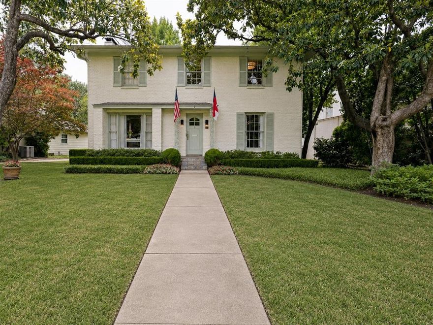 Discover timeless elegance in this beautiful 1951 center-hall brick colonial, perfectly situated in the highly coveted Greenway Parks neighborhood, and featuring a sophisticated Farrow & Ball-inspired exterior color palette! Steeped in classic charm and flooded with natural light, the gracious two-story home features a welcoming center-hall floor plan. Elegant formal living and dining rooms, gleaming hardwood floors, and a sun-drenched sunroom overlooking a charming brick back patio - gracefully umbrellaed by majestic bald cypress trees - create an inviting setting for both everyday living and effortless entertaining. The thoughtfully designed open kitchen flows seamlessly into a bright breakfast area, while a cozy wood-burning fireplace adds warmth and ambiance on crisp winter evenings. A stylish powder bath with Cole & Sons wallpaper completes the main level. Upstairs, the private primary suite offers an enchanting view of the backyard's stately matured trees. Two additional spacious bedrooms share a full bath with Thassos marble tile. A true standout is the detached two-story guest house, delivering an impressive 900+ add'l sq ft of versatile living space. It includes two bedrooms, one full bath, and one half bath, and storage - ideal as a home office, nanny suite, in-law quarters, or private retreat for adult children.  Set on a generous 70' x 178' lot, the property provides ample room for a future swimming pool, expanded gardens, or an outdoor oasis.  Greenway Parks, master-planned in the late 1920s by famed architect Dave Williams, is a treasured enclave of just 290 homes. Residents enjoy its harmonious mix of historic architecture, strong sense of community, expansive parks, lush green spaces with walking paths, and a full calendar of engaging annual events.  This rare opportunity blends historic character with modern comfort in one of Dallas’s most sought-after neighborhoods. Schedule your private showing today!