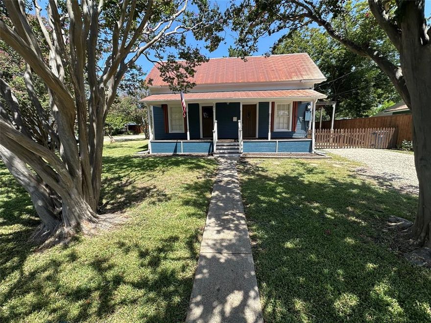 RARE ROCKWALL FIND!!!!! Short stroll to downtown shops and restaurants. Precious vintage exterior, completely updated interior! Large corner lot framed with giant blooming Crape Myrtles.This lovely home features original hardwood floors and thick historic molding around doors & windows. Updated kitchen and utility room with new tile flooring, stainless steel gas stove, and dishwasher. Freshly painted interior, with new decorative light fixtures and ceiling fans. Large carport and a storage building in the rear. Large covered front porch. Fenced yard. Contact agent for showings.