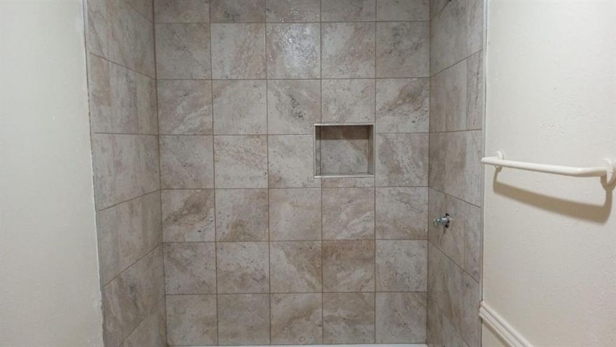 New paint, new cabinets, new granite counter top, new kitchen faucet, new shower tiles