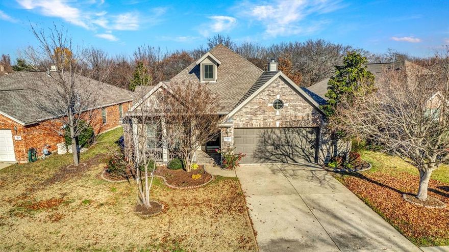 An impeccable one-story residence situated perfectly within the neighborhood by the creek, featuring a lovely front porch & secluded yard & serene park views. Its open-plan design is enhanced by high vaulted ceilings, elegant wooden flooring throughout the main spaces and the master suite, and an abundance of natural light, creating an inviting ambiance. The living area, complete with a fireplace, seamlessly connects to the kitchen, perfect for entertaining. The formal dining area adorned with recessed and chair rim wall accents. The generously sized kitchen showcases granite countertops, a breakfast bar, a stylish backsplash, and ample storage. The primary bedroom includes a luxurious garden tub, a spacious walk-in closet, a separate shower and a double vanity. Step out onto the covered back patio and you can't help but notice the picturesque outlook for the yard with a combination cedar and metal fencing for privacy. This residence is immaculate and waiting for you to call it home.