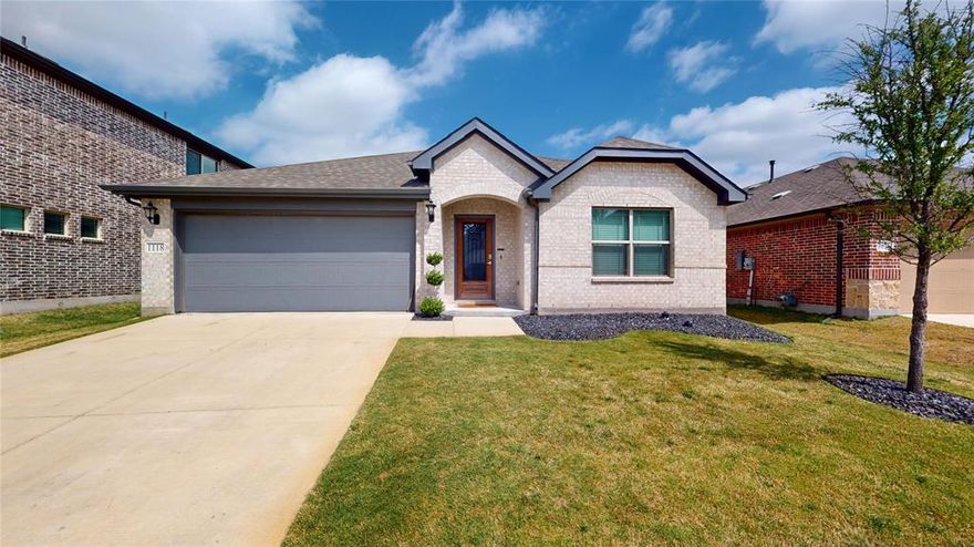 Well-maintained with a functional and open layout, this home offers comfortable living with quality finishes throughout. The spacious living room flows seamlessly into the kitchen, creating a great setup for everyday living and entertaining. The kitchen features a large island, granite countertops, decorative backsplash, gas range, vent hood, stainless steel appliances, and a walk-in pantry. The private primary suite includes a walk-in shower, dual sinks with granite countertops, and a walk-in closet. Split secondary bedrooms are located toward the front of the home and share a full bathroom with granite countertops. Conveniently located within walking distance to Anna High School, with nearby dining and continued growth in the area adding to the overall appeal.