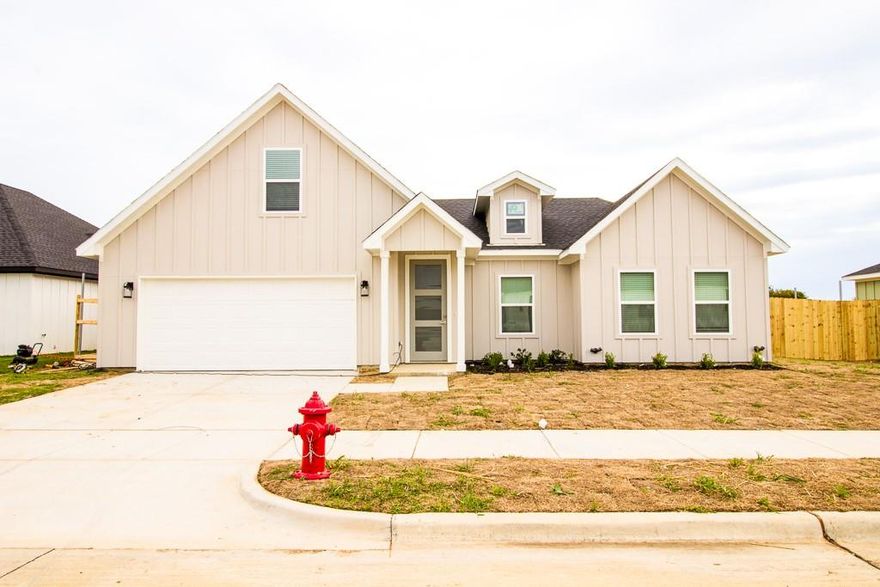 Lovely and thoughtfully designed new construction home consisting of four bedrooms (three downstairs and one upstairs) with two full bathrooms, two car garage with opener, large fenced in backyard, and ceramic flooring throughout with carpet in upstairs bedroom.  The living room is airy and spacious while connecting to the kitchen and dining area providing the perfect mix of comfort and space for entertaining. The kitchen has custom wood cabinets with soft close hinges, recessed lighting, gas stove and stainless-steel appliances. This home is situated in the desirable Godly ISD while delivering a modern home design, quality custom finish out and is move in ready.  You won't want to miss touring this gem!