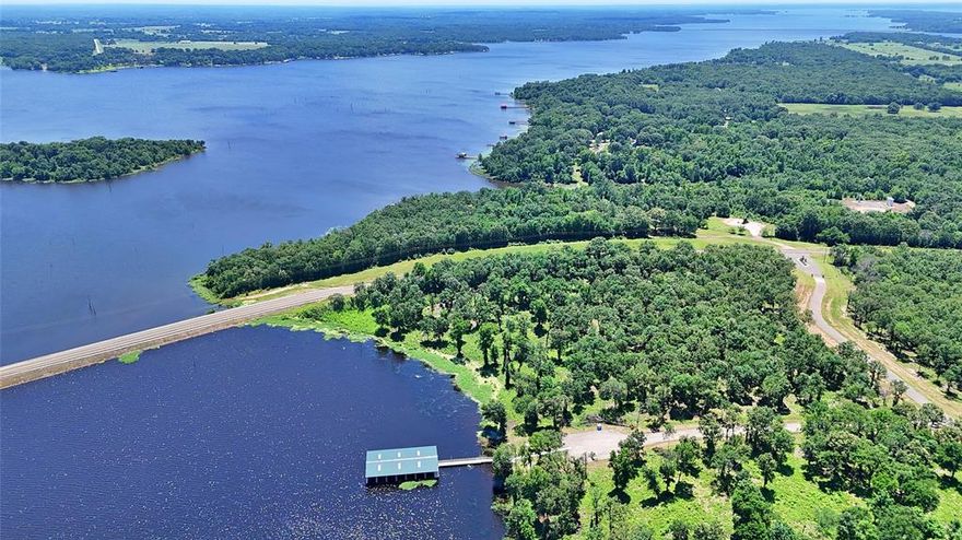 Welcome to your new lakefront paradise on Lake Fork!  Teeming with wildlife, towering trees, and a gorgeous view of arguably the best bass fishing lake in Texas, this special waterfront property offers you the rare opportunity to enjoy a massive lake, but also appreciate the privacy of a protected cove and a small gated community.  There aren’t many waterfront properties like this!  Just over an hour's drive from Dallas and with the ability to build your private boat house or pier right into one of the most coveted lakes in the entire state.  Anglers Shores features a private gated entrance, paved roads, underground electricity and water, and sensible protective covenants to ensure a peaceful and liberating experience every time you arrive at the lake.  Lot 5 has 1.01 acres of deeded land and an additional 0.62 acres + 112 feet water frontage of SRA land to enjoy!