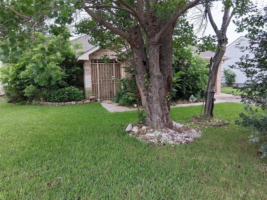 Charming 3 bedrooms, 2 bath home perfect for first-time buyers, and anyone seeking comfort and convenience.  This cozy property features ceiling fans in living area and each bedroom, ceramic tile flooring throughout the main areas and soft carpet in the bedrooms, dinning and living area.  The kitchen includes a welcoming breakfast bar - ideal for casual meals or morning coffee.  A separate laundry room adds extra functionality and storage.  Step outside to a fully fenced backyard offering plenty for family gatherings, playtime, or weekend barbecues.  This home also includes an attached 1 car carport for added convenience.  Overall, this is a wonderful starter home with great potential and every day comfort.   For added security and safety it comes with an alarm system.