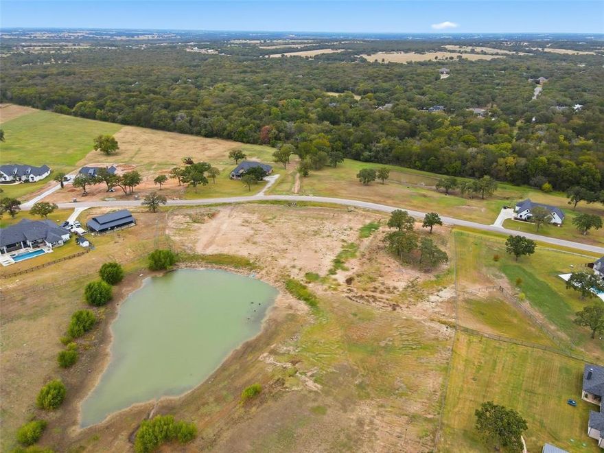 Beautiful 2 plus acre lot with plenty of space to build your dream home complete with privacy and nature all around plus a scenic pond view. Located in coveted Las brisas  has fiber optics and conveniently located to shopping and restaurants. Peaceful and tranquility awaits!