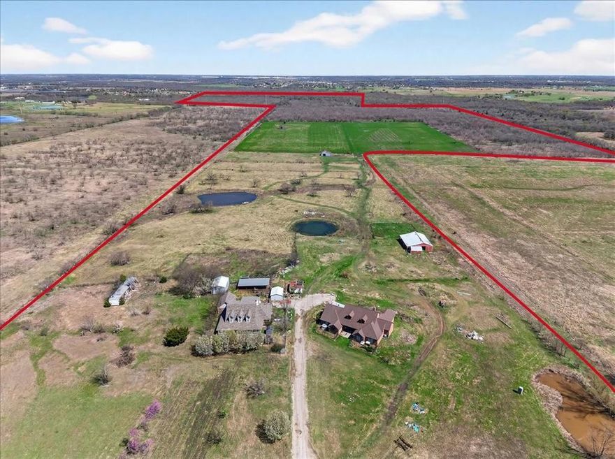 Rare opportunity to own 214+ acres in Kaufman County, located in one of the fastest-growing areas in Texas while still offering incredible privacy and wide-open space. The property features two homes, each with 5 bedrooms and 3.5 bathrooms, making it ideal for multi-generational living, guest accommodations, or ranch staff.  The land includes multiple outbuildings and barns, along with several scenic ponds that provide fishing and water sources for livestock and wildlife. With multiple building sites across the property, this acreage offers tremendous potential for a private family compound, ranch, or future development.  Abundant wildlife makes for great hunting opportunities, including whitetail deer, hogs, coyote, and more. With multiple water sources throughout the property, diverse terrain, and exceptional seclusion, this property offers the perfect balance of recreation, agriculture, and investment potential.  A truly special large acreage property within convenient reach of the DFW area.