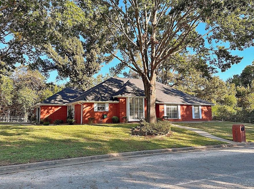 This custom built home is located on a large corner lot with majestic hardwoods. Amenities include a semi-open floor plan with formal dining, breakfast, large kitchen with bar and breakfast area, oversized master bdrm with his or her walk-in closets, spacious utility room and a WBFP. Outdoor amenities includes wrap-around sidewalks, an RV or Boat parking pad, large back deck with a built-in custom BBQ pit, landscaped with sprinkler system and a separate storage building.