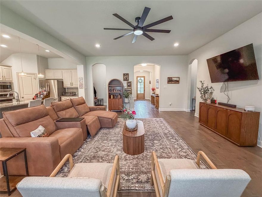 From the moment you arrive, this thoughtfully updated J. Houston home welcomes you with comfort, style, and a sense of easy living. The current seller has invested thousands into personalized custom improvements, but with changing circumstances its now ready for you to enjoy. Featuring NEW luxury vinyl plank flooring throughout (no carpet anywhere), updated fixtures, modern fans, a refreshed front door, and smart exterior lighting designed to save you both time and money. A spacious entry opens into an inviting living area with a cozy fireplace, flowing seamlessly into an entertainer’s kitchen with a large island and a generous breakfast nook perfect for gathering. The desirable split-bedroom layout offers privacy, while the secluded primary suite serves as a peaceful retreat with a luxurious bath and expansive closet. Step outside to the covered patio - ideal for quiet mornings or unwinding at the end of the day. Nestled in a quiet Cove subdivision with access to a community pool, park, walking trails, shops and restaurants. This home also includes approximately two years remaining on the foundation warranty from J. Houston Homes. Washer, dryer, and refrigerator are negotiable with the right offer, and a full spec sheet with paint details is available upon request—making it easy to envision your next chapter here.