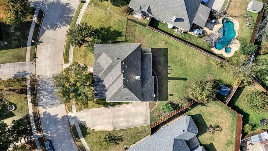 Spacious home in sought-after Murphy Farms with award-winning schools and a welcoming community feel. Situated on a quiet, winding street, this home features an oversized lot with an extra-wide side-entry driveway and a large backyard offering privacy and room to enjoy outdoor living. The covered patio includes a TV hookup and gas line, ideal for relaxing or entertaining. Mature landscaping, St. Augustine grass front and back, exterior lighting, and an 8-ft board-on-board fence complete the outdoor space.

Inside, the home offers fresh interior paint and new carpet (2025), raised ceilings, rounded corners, iron-spindle staircase, surround-sound wiring, and ceiling fans throughout. The main floor includes multiple living spaces, a flexible office or bonus room, and a downstairs bedroom perfect for guests or multigenerational living.

The kitchen features granite countertops, gas cooktop, stainless steel appliances, stone backsplash, and abundant cabinet space, opening to the main living area with fireplace. Upstairs includes a spacious primary suite with jetted garden tub, separate shower, dual sinks, and a walk-in closet, along with a large second living area. All secondary bedrooms include walk-in closets.

Conveniently located near parks, schools, and major commuting routes, this home offers space, comfort, and a great opportunity in one of Murphy’s most established neighborhoods.