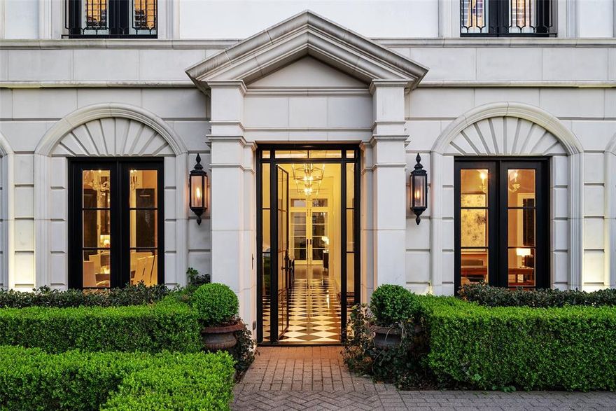 Swoon Worthy University Park custom built home with impeccable detail, walking distance to Highland Park Village and highly sought Bradfield Elementary. This timeless classic Georgian-styled home offers 4 bedrooms and a study in the main house plus an ensuite 5th bedroom in the separate detached quarters over the two car garage. Beautiful drive-up with boxwood maze garden leading to the impressive entry with wrought-iron and glass door. The stylish black and white marbled foyer is flanked by the formal dining room with double French doors and a handsome library with fireplace and built-in shelving.The open concept kitchen-living-breakfast area is ideal today's lifestyle, well suited for everyday living and entertaining. The chef's kitchen features a large eat-around marble island with professional grade  Viking appliances including a gas range, double ovens and a built-in refrigerator. The main living area is anchored by a fireplace and French doors opening to the covered terrace and outdoor living area with built-in grill. The primary bedroom with fireplace and sitting area is complimeted by a marble bath with dual vanities, soaking tub, separate shower and customized walk-in closet. Separate detached quarters over the garage add an additional 520 square feet (per DCAD) that are not included in the square footage and is ideal for a 5th bedroom, second office or flex space. This very special property offers an incredible opportunity for those seeking a welcoming and luxurious home in one of the best locations in the Park Cities.