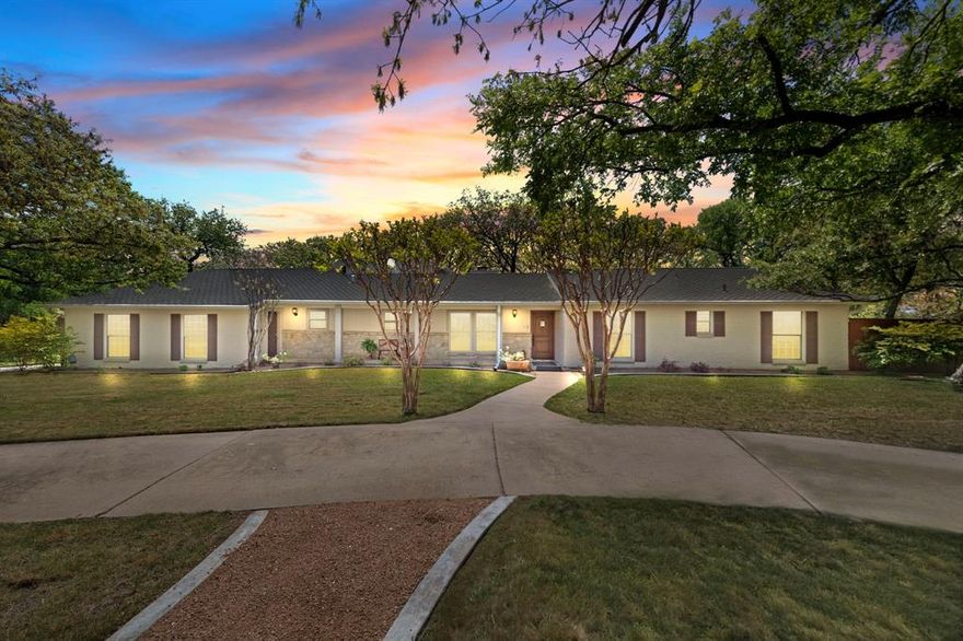 UPDATE SELLER OFFERING CONCESSIONS TO COVER ONE YEAR OF PROPERTY TAXES AND,OR WILL CONSIDER RATE BUY DOWN OPTION ON AN OFFER BY OFFER BASIS..  Come and See this amazing and one of a kind property. Nestled on 2.8 acres of peaceful country living in the heart of DFW, this stunning Dalworthington Gardens property offers a unique blend of comfort and convenience. The handicap-accessible main house features four bedrooms, three and a half baths, and a spacious loft. The kitchen boasts granite countertops, an induction cooktop, and a double oven, while multiple fireplaces add warmth and charm throughout.

A separate guest house provides three bedrooms, one bath, a wood stove, ample storage, a safe room, and its own utilities. The long driveway accommodates extra vehicles, trailers, RV, and boat parking. A covered front porch, mature landscaping, and beautiful trees enhance the curb appeal.
Inside, the inviting living area features built-ins, a ceiling fan, and a cozy wood-burning fireplace. The luxurious primary suite includes an ensuite bath with redwood accents, dual vanities, a shower, and a grand soaking tub.

Outside, enjoy scenic views, a fenced pasture, a garden, a shed, and an RV pad with a 50-amp hookup. A whole-home generator ensures reliability and peace of mind. This exceptional property is ready to welcome you home—schedule a showing today!