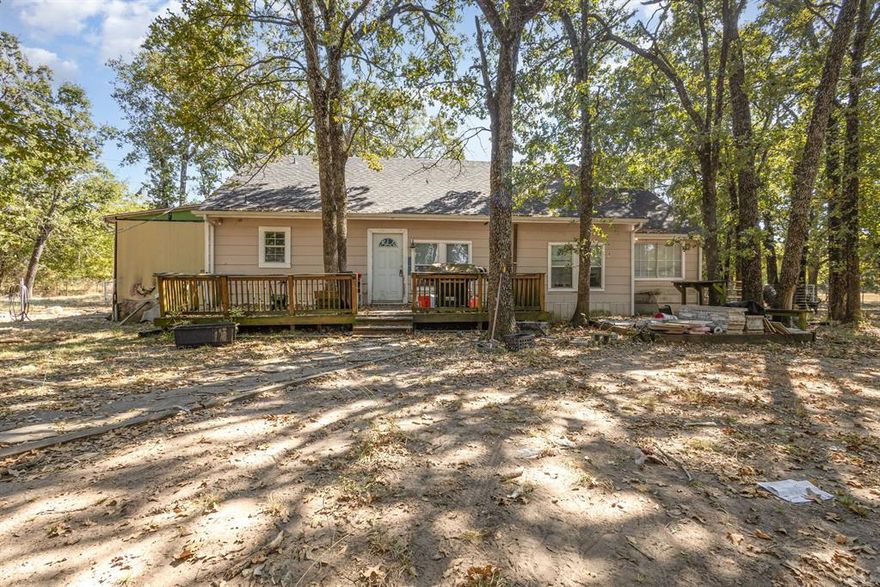 Investor special with tons of potential! This 3-bedroom, 1-bath home sits on a 1-acre wooded lot and includes an office and craft room, providing flexible space for work or hobbies. A laundry and bathroom addition is ready to be finished, offering the opportunity to add value and customize to your liking. Property is being sold AS IS.  Don’t miss this chance to bring your vision and unlock the possibilities—schedule your showing today!