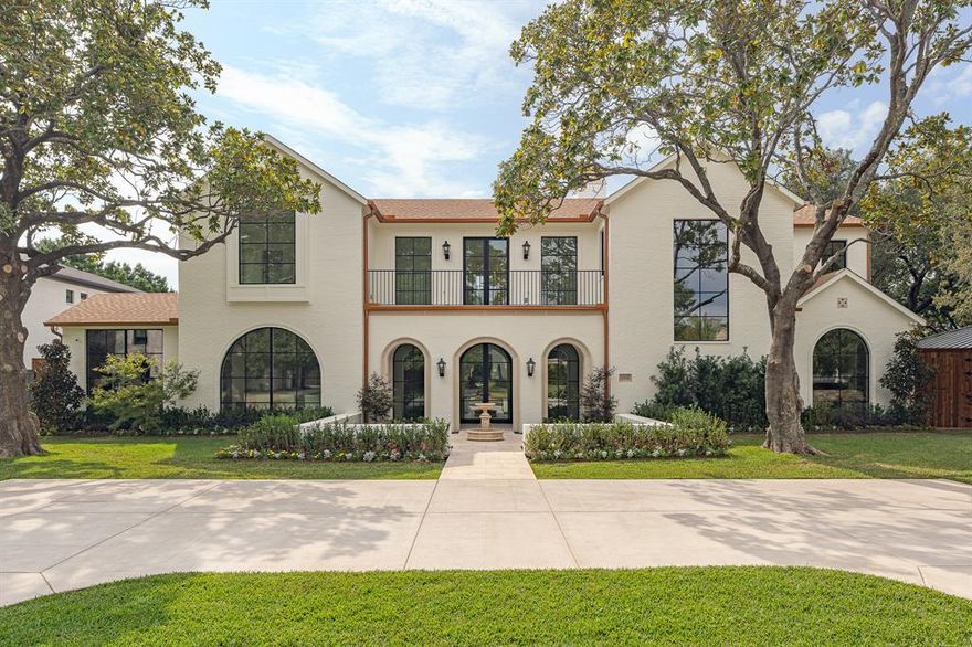 Experience refined living at its best in this newer construction transitional European residence in the heart of Preston Hollow. Perfectly blending French architecture with Mediterranean warmth, this home captures timeless elegance while delivering a truly modern luxury lifestyle. From the light brick façade and steep rooflines to arched windows framed in black steel, every exterior detail creates a striking first impression. A central balcony with wrought-iron detailing and lush planter boxes adds classic European charm and architectural balance. Inside, soaring ceilings, walls of windows, and an abundance of natural light highlight a seamless flow between formal and casual spaces designed for both everyday living and grand entertaining. The chef’s kitchen anchors the home with designer finishes, premium appliances, and an effortless connection to the expansive living and dining areas. Thoughtfully designed spaces offer flexibility for work, relaxation, and hosting guests, while the spacious bedrooms provide privacy and comfort throughout. Step outdoors to a hotel-inspired backyard retreat featuring a stunning pool and lounge terrace—your own private oasis perfect for entertaining or unwinding under the Texas sky. Every finish and material has been carefully curated to create a harmonious blend of tradition and innovation. Ideally located minutes from premier private schools including St. Mark's School of Texas, The Hockaday School, and Episcopal School of Dallas, and just a short drive to shopping and dining at Whole Foods Market. This exceptional residence offers the rare opportunity to enjoy timeless design, modern sophistication, and unmatched convenience in one of Dallas’ most prestigious neighborhoods.