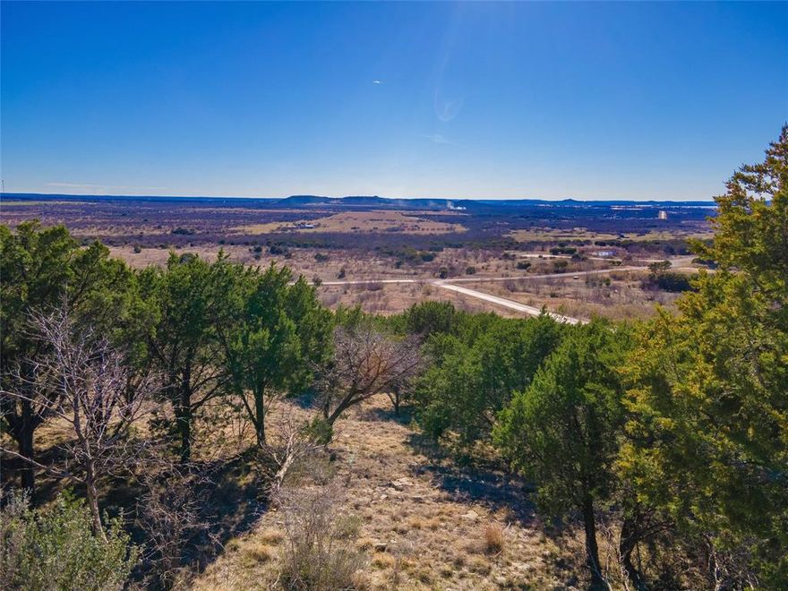 Exceptional hilltop lot with expansive 180 degree panoramic valley view. Potential lake view from a second floor home. This lot could be made into a hilltop paradise or the lower plateau could be turned into an exquisite home tucked in on the hillside. Ownership grants access to all the amenities in The Hills Above Possum Kingdom HOA. Enjoy the club house, fitness center, hilltop lake view pool, boat ranch, and more. Take advantage of owning more than an acre near one of Texas's most beautiful lakes.