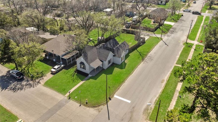 Completely renovated in 2025, this incredible home features all brand new finishes! Located on a premium corner lot, this home features desirable side-gate access perfect for your RV or boats, along with a 2-car rear driveway. The bright and spacious floorplan features a large living room area flowing into the open eat-in kitchen, featuring sparkling marble countertops with all new stainless steel appliances included! Four extra-spacious bedrooms accommodate even your largest furnishings. A large walk-in pantry is right off the kitchen, with a full-size laundry room and window. Easy access to indoor & outdoor living from your large front porch and comfortable back deck. Brand New finishings include: Roof, plumbing, Luxury Vinyl Plank hardwood flooring throughout, interior and exterior painting with designer colors, new luxury vanities with double-sinks, new deep-soaking bathtubs with shower-surrounds and hardware, new light fixtures, and more! Close proximity to Downtown Denison, shopping, cafe's and dining. With its sprawling floorplan, superb finishes, sun-filled living spaces and prime corner-lot location near vibrant Downtown Denison, this residence will welcome you home!