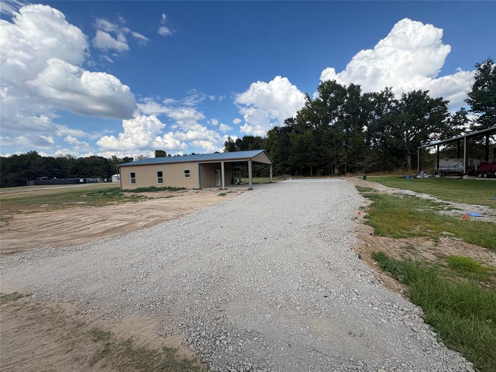 Photo of 644 Comanche, Quitman, TX 75783 (MLS # 21375001)