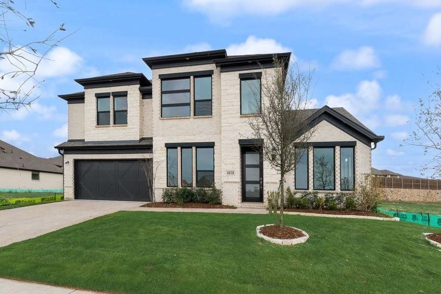 Entertain in style in this all new Grand Home located in Monterra, a premier master-planned community offering exceptional amenities, including a swimming pool, splash pad, scenic bike trails, a park, and pickleball courts. Nestled within the highly acclaimed Rockwall ISD, this beautiful 2-story home features four spacious bedrooms and 6 living spaces.
The open-concept family room showcases wood floors and a two story fireplace with a wet bar and a wine storage with glass walls. The chef’s kitchen is complete with a large island, Omegastone slab countertops, elegant white Shaker cabinets, deep full-bowl sink, stainless steel appliances, a commercial style 8 burner gas cooktop with double ovens and a commercial vent hood, pots and pans drawers, a walk-in pantry, a built-in trash drawer.
A flexible layout provides space for a formal living room or dining, a home office, a downstairs media room, while upstairs there is a gameroom plus a bonus room for entertainment space. Custom finishes include 8-foot doors, pre-wiring for flat-screen TV, and wood flooring. The primary suite offers a luxurious retreat with a freestanding soaking tub, glass-enclosed shower, dual sinks, and wood floors in the bedroom.
Energy efficiency is built into every detail with Energy Star certification, R38 insulation, and a tankless water heater. Enjoy the perfect blend of comfort, style, and convenience—just minutes from Lake Ray Hubbard, with abundant shopping and dining nearby.