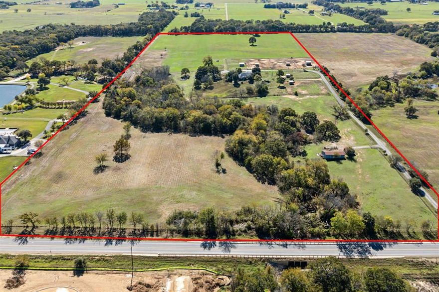 Forty acres of breathtaking land featuring a vast array of development options. This rare opportunity offering is unzoned and in the ETJ offering a wide array of possibilities in addition to being agriculturally exempt. This property is a canvas, painted not just with flat, traditional features, but enhanced by the majestic allure of towering, mature trees. The undulating topography offers spots for breathtaking vistas and hidden retreats, where one can lose themselves in the serenade of rustling leaves and chirping songbirds. Meandering gracefully through this captivating landscape, a lovely creek adds a touch of serenity, inviting you to sit back, relax, and savor the gentle flow of life. Whether envisioned as a luxurious private estate or an innovative development brimming with potential, this property transcends the ordinary, delivering an inspiring atmosphere for exploration and creation. As development is exploding in Aubrey, this property is very well positioned for the growth being directly on a major arterial road and with quick access to Highway 377 and the proposed upcoming Outer Loop which will connect I-35 to the Dallas North Tollway. New nearby grocery stores and other large retail projects are planned to add to your shopping convenience.