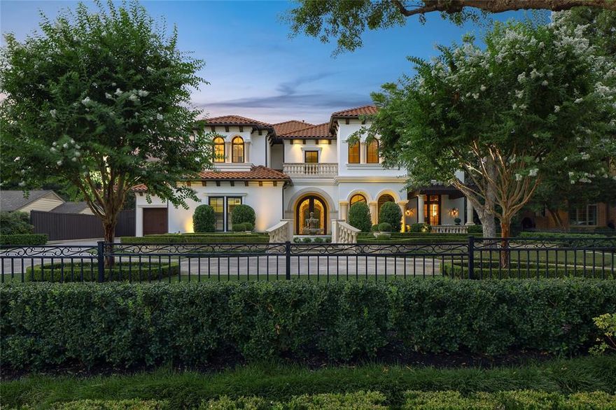 Set on a premier street in Preston Hollow, this elegantly appointed Santa Barbara–style estate offers timeless architecture, refined interiors, and luxurious amenities. Mature landscaping provides privacy for a home designed for both grand entertaining and everyday living. The stately exterior features smooth stucco, concrete tile roof, multiple water features, and manicured grounds. Inside, a dramatic double-height foyer with marble floors and a sweeping staircase sets the tone. The main level includes a state-of-the-art theater, handsome study with gas fireplace and private terrace, en-suite artist’s studio, 500-bottle wine cellar, wet bar, and groin-vaulted dining room opening to an atrium with fountain. The private primary suite boasts vaulted ceilings, sitting room, dual bathrooms and closets, and a secluded garden retreat. The gourmet kitchen is equipped with Viking appliances, quartzite island, Bosch dishwasher, dual refrigerators, walk-in pantry, and wet bar. It flows into a spacious family room with gas fireplace and walls of windows overlooking the pool, spa, and serene water features. Upstairs, accessed via elevator or dual staircases, are three en-suite guest suites with large walk-in closets, a Ralph Lauren–inspired game room, fully equipped bar room, and bonus room. A walk-in attic offers ample storage. The nearly half-acre lot is designed for outdoor living, featuring artificial turf, a 40 ft magnolia hedge for total privacy, extensive lighting, and kitchen with Lynx grill, beverage fridge, prep area, and ice maker. The heated pool and spa complement the home’s architecture. Built by Zachary Custom Homes, this estate includes a 2021 concrete tile roof with radiant barrier, elevator, slab foundation, five HVAC units, three water heaters, and a three-car garage. Additional features: Lutron lighting, security system, mosquito misting, and landscape lighting. A rare opportunity to live with elegance and ease in one of Dallas’s most coveted neighborhoods.