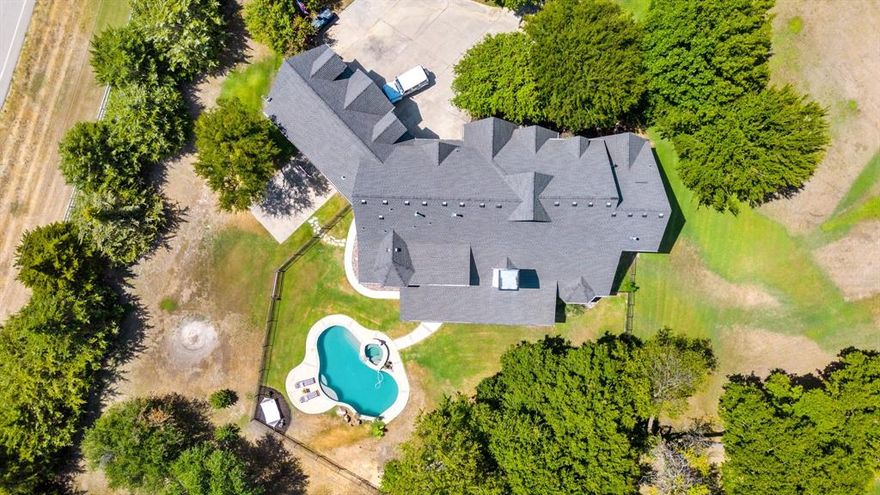 Stunning renovated custom home w waterfront views situated on 2+acre lot. Modern design meets elegance from the oversized waterfall quartz island in the kitchen to dual rain showers & built in coffee bar in the master suite, marble like floors in the sunken living room, cathedral ceilings, 8ft solid core doors, home office & more. Gourmet kitchen equipped w commercial grade Wolf gas cooktop, double convection ovens, & sub zero fridge. Master suite with spa like bath & private guest bedroom & bath located on 1st floor. Texas size gameroom upstairs along with 3 bedrooms, one could be a huge theater room or separate master suite. Sprawling windows showcase the gorgeous backyard with pool, spa & outdoor living that overlooks multiple stocked ponds. Exterior modern lighting, three and a half car garage, painted brick and white washed stone exterior transforms this beautiful home into updated and modern luxury. Surrounded by other estate homes & ponds, coveted Preston 455 is centrally located yet tucked away with convenience to A+ rated schools, retail & the famous Celina Downtown Square. Rare acreage community that has natural gas & no septic, no PID or MUD!