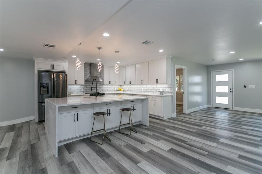 Welcome to your new oasis! This elegant 4-bedroom, 3-bathroom home boasts a spacious yard and a recently renovated pool, offering the perfect setting for outdoor enjoyment and relaxation. Step inside and discover a residence that feels just like new construction. Every aspect of this home has been meticulously renovated, from the freshly installed flooring, electrical systems, windows, and roof to the custom cabinetry in the kitchen, complete with a stylish custom island
The open floor plan creates a seamless flow between living spaces, enhancing the sense of spaciousness and connectivity throughout. Designer light fixtures and upgraded recessed lighting add a touch of luxury to every room.
The heart of this home is its updated kitchen, featuring stainless steel appliances, chic cabinetry, and stunning countertops. The bathrooms have also been thoughtfully updated with modern fixtures and frameless showers, elevating your daily routines.