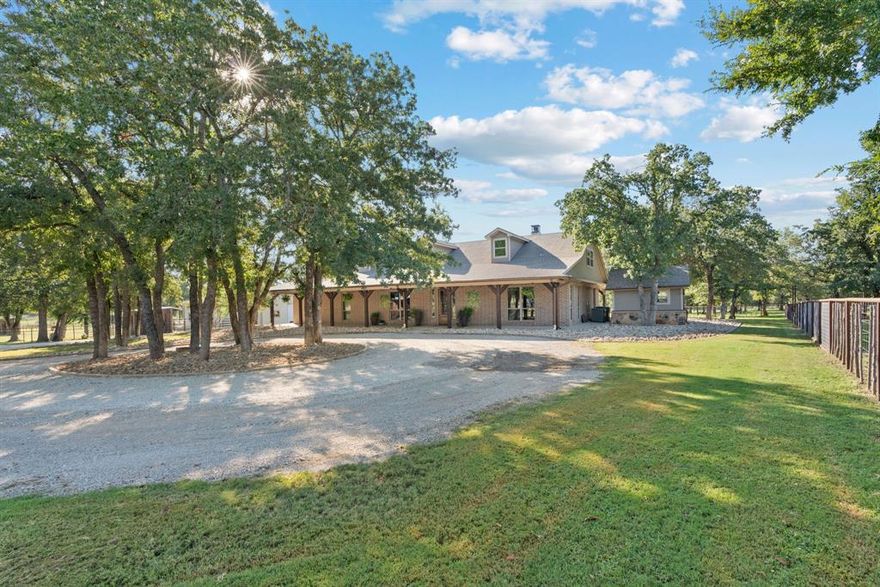 Welcome to 8211 Lone Star Road, an unparalleled equine estate that blends luxury and functionality. This stunning **4,062 sqft** remodeled home features **4 first-floor bedrooms**, including a master suite with a sitting area and spa-like bath. The chef's kitchen and spacious living areas offer an ideal setting for family gatherings. Equestrian enthusiasts will revel in the comprehensive facilities: a **14-stall horse barn** with automatic waterers, a vet-bathroom, and a huge tackroom for convenience. The **covered arena** (132’x300’) features premium LED lighting and ample space for training, complemented by a new Priefert roping chute plus 24 additional horse stalls. A **mare foaling barn** with six stalls offers comfort and care for breeding. Pastures are meticulously fenced, featuring **14 pipe-fenced areas** with heated waterers and five stocked ponds. Additional amenities include a workshop with living quarters, a storage barn with living quarters, and a custom chicken house. This estate is a haven for both horses and homeowners alike! Schedule your private showing today!