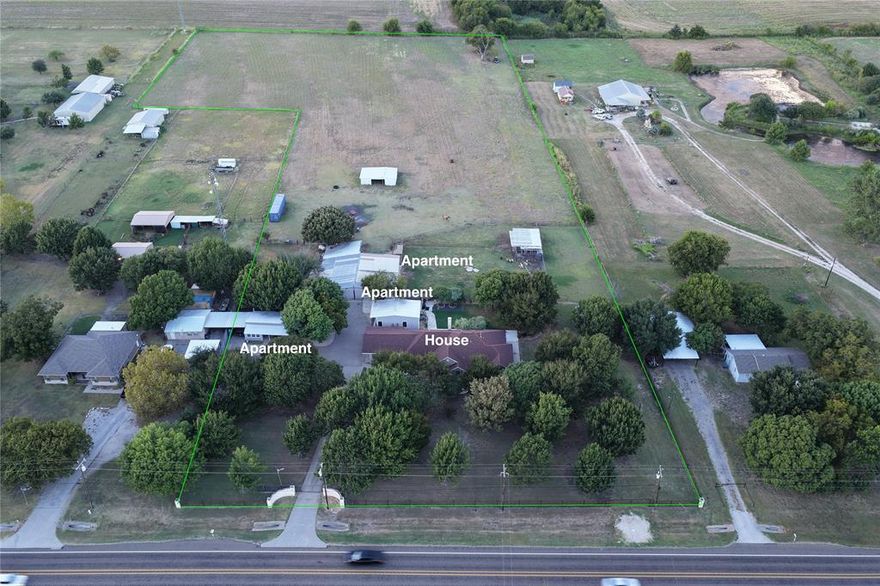 Plus or minus 8 acres outside city limits with no known restrictions. Property has a 3 finished out and rent ready housing units and one unfinished shell housing unit with plenty of room for expanding more units. Gated and two points of ingress and egress. Buy and grow your family or expand multifamily units on the remaining land. The property also features a drive through shop building and fenced in area for cattle or pets. Well maintained and ready for immediate use. Country living within minutes of city conveniences. Easy access to 287 or IH 35. Shopping and food is 5 minutes in either direction. Setup a time to visit today.