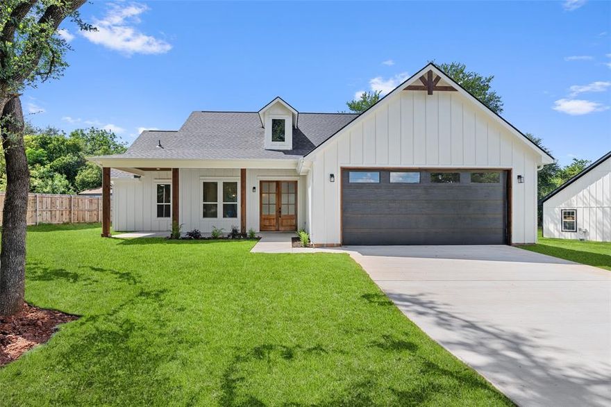 Step into modern elegance with this brand-new construction home, offering a perfect blend of style, comfort, and functionality. Featuring 3 spacious bedrooms, 2 beautifully appointed bathrooms, and a 2-car garage, this home is designed with thoughtful details throughout. The elegant double entry doors create a grand first impression, welcoming you into a home that feels both inviting and upscale. The heart of the home is the open-concept living area, where decorative ceiling beams add architectural charm and warmth. Golden light fixtures offer a modern touch, while sleek black countertops provide striking contrast in the kitchen. Whether you're entertaining or enjoying a quiet evening, the layout offers the ideal balance of openness and privacy. The primary suite is a true retreat, complete with an ensuite bathroom that includes separate vanities, a standalone soaking tub, and a luxurious walk-in shower. A barn door opens to a spacious walk-in closet, offering both charm and ample storage.
Additional highlights include a mudroom with generous space to keep shoes, bags, and daily essentials neatly organized, and covered front and back porches—perfect for morning coffee or winding down in the evenings. Every detail in this home has been carefully selected to enhance everyday living. From designer fixtures to smart layout choices, this property is ready to impress. Don’t miss the opportunity to own a home where modern design meets practical comfort!