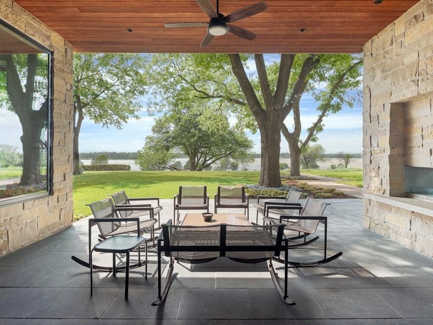 9210 W Lake Highlands Drive is an extraordinary retreat, privately positioned to capture unobstructed panoramic views of Downtown Dallas and the full expanse of White Rock Lake. With 5 bedrooms, 4 baths, this beautifully designed residence blends sophisticated interiors with an unforgettable natural setting.

Created for elevated everyday living and exceptional entertaining, the home is defined by its seamless connection to the outdoors. Walls of sliding glass doors open completely, inviting the lake in and revealing breathtaking water and skyline views at every turn. At the heart of the home, the open gourmet kitchen is both refined and functional, designed for gathering with ease while remaining connected to the home’s stunning living spaces and vistas beyond.

An oversized indoor fireplace anchors the main living area with warmth and architectural presence, while an outdoor fireplace extends the experience to the home’s generous porches and terraces, creating inviting spaces for year-round entertaining. From morning coffee overlooking the lake to evenings spent by the fire with the downtown skyline shimmering in the distance, every detail is designed to celebrate the setting.

Crowning the home is a rooftop deck that offers a spectacular perch for watching sailboats glide across White Rock Lake, city lights sparkle at dusk, and stars fill the night sky. Rarely does a property offer this level of beauty, privacy, and lifestyle in such a premier Dallas location.

9210 W Lake Highlands Drive is more than a home—it is a statement property, offering timeless design, remarkable views, and a truly elevated way of living.
