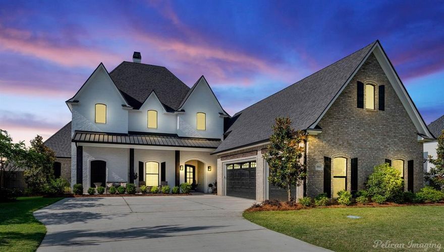 Offering unparalleled luxury and modern comfort, this residence boasts a 
thoughtful open concept design perfect for today's lifestyle and nestled
in the prestigious gated community of Southern Trace.  Soaring ceilings
and expansive living spaces create a welcoming atmosphere.  The heart
of the home is an exceptional chef's kitchen, outfitted with industrial style
appliances, which includes an icemaker and wine fridge, an expansive
island and abundant storage solutions.  The downstairs primary suite 
serves as a private retreat, featuring a cozy fireplace and a tranquil sitting
area.  Outdoor living takes center stage with an newly added, inviting custom salt water
heated pool, framed by professionally designed landscaping.  Beautiful
upgrades to this property, including brick on fireplace wall and primary
bathroom wall, floor surface coating in garage and textured surface on
patio, both with warranty, whole home generator, 
custom automatic shades, custom window treatments and the list
goes on!!  You are going to love this special home perfect for family living
and entertaining!!

Seller has made over $200,000 in improvements to the home since purchasing as a new build. See updrade list in MLS documents.