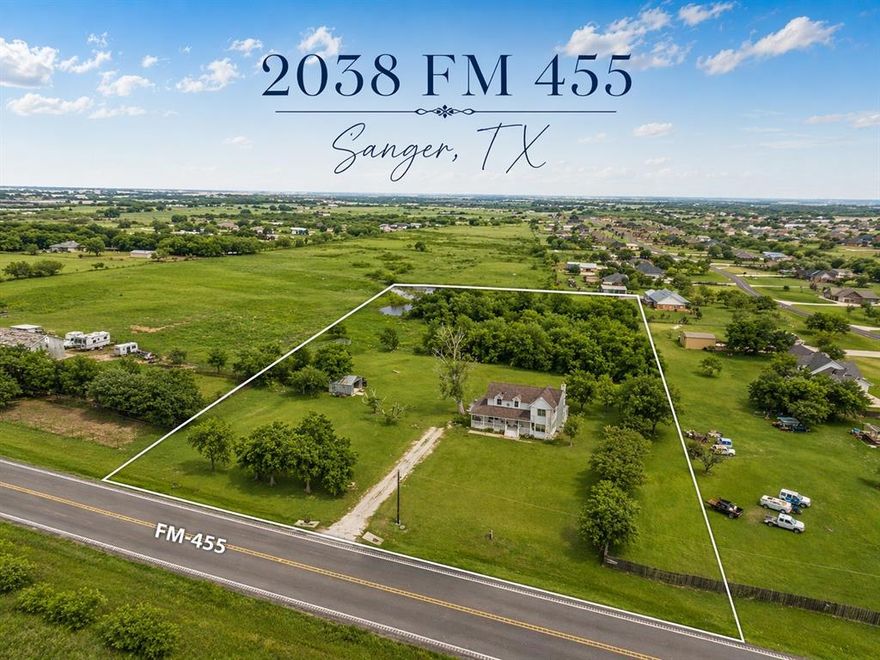 Positioned in the path of rapid North Texas growth, this 5.5-acre property offers a rare opportunity to secure high-visibility land along a well-traveled FM road in the Sanger area. With expanding development nearby and strong road frontage, this property presents excellent potential for future investment, development, or commercial consideration (buyer to verify). Conveniently located just a short drive from Lake Ray Roberts, the property also offers added appeal for recreation and lifestyle.

Beyond the land, the property tells a different story. A stately traditional farmhouse anchors the land, offering a setting that feels private and peaceful despite its prime location. The large, two sided covered front porch overlooks open pastureland, creating a true country atmosphere.

Inside, the home features character that is hard to replicate, including beautiful wood ceilings and exposed beams. The layout offers a primary bedroom downstairs with additional bedrooms upstairs, providing a functional footprint for those looking to restore and transform the home into something truly special. While updates are needed, the potential is undeniable for a buyer with vision.

Whether you’re looking to invest in the future growth of the area, develop, or create a one-of-a-kind homestead with long-term upside, this property offers a unique combination of location, land, and opportunity.

Buyer to verify all information, including zoning, land use, and future development possibilities.