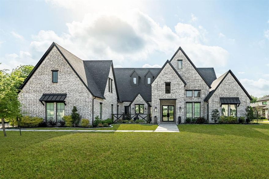 A slice of Heaven! This stunning custom J. Anthony home sits on ONE ACRE with a gorgeous pool & spa on a quiet cul-de-sac, and truly shows like new. A welcoming front porch and private courtyard set the tone. The fantastic one-story layout includes stairs leading to 1,250 sq ft of unfinished attic space - easily finishable for additional living area and instant equity potential of $200k+. Inside, the open, bright design features hardwood flooring, modern neutral tones, high ceilings, and thoughtful custom touches throughout. The chefs kitchen impresses with Monte Blanc quartzite, a large island with seating, 6-burner gas cooktop, built-in refrigerator, and a separate prep kitchen with quartz counters tucked conveniently behind a doorway. The spacious living room is the heart of the home, showcasing a floor-to-ceiling fireplace and a wall of windows overlooking the backyard oasis. The luxurious owners retreat offers dual vanities with leathered granite, a soaking tub, double shower, and a custom closet. Four secondary bedrooms each include their own ensuite bath and walk-in closet. The dedicated office features a speakeasy bookcase door leading to a bonus flex room, and the home also includes a large game room and media room. An oversized utility room, and mudroom area sit just off the 4-car garage. Step outside to your dream backyard: an oversized covered patio with brick fireplace and built-in grill area, plus a sparkling pool with spa, tanning ledge, and waterfalls. The expansive yard is fully enclosed with wrought-iron fencing and lush landscaping. Enjoy a convenient golf-cart path to nearby schools. Exemplary Lovejoy ISD with quick access to highways, shopping, and dining.