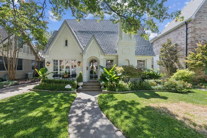 Welcome to 3417 Purdue Avenue, a fabulous expanded Tudor in University Park. This spacious home offers 5 bedrooms and 4 baths, and is tastefully updated to blend modern conveniences with classic charm across 4,085 sq ft.
Step inside to discover a bright sun porch and a living room featuring original stained glass windows and custom details that exude warmth and character. Formal dining room with arched doorway leads to gourmet kitchen, adorned with marble countertops and stainless steel appliances. A cozy den perfect for family gatherings opens to the kitchen and overlooks backyard. Additional room with custom bar could serve as extra living or dining space and opens to a fantastic backyard with covered patio, built-in grill, pool, turf, and attached two-car garage with rolling gate.  
A downstairs bedroom with built-ins and full bath with designer wallpaper complete the first floor. Upstairs, the primary suite with vaulted ceilings offers a serene escape with marble bath and a balcony overlooking the backyard. Three additional bedrooms and a large game room are also upstairs. 
Located on a wonderful block in HPISD, this home offers a flexible floor plan and is packed with charm and character. Walking distance to University Park Elementary, the UP pool, and great shopping and dining in Snider Plaza, this prime location can’t be beat!