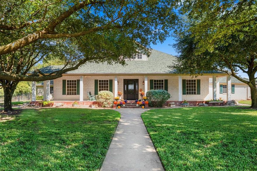 Beautiful retreat for an animal-loving family on 4.3 acres. The first floor offers 10 ft ceilings, an owner’s suite, three additional bedrooms, 3.5 baths, a kitchen with upgraded appliances, a large pantry, a home office with a scenic view, a breakfast nook, a laundry room, and a living area with a propane fireplace. Features include plantation shutters, stained glass, wood trim, and recently added ceiling fans. Upstairs are a game room, an extra bedroom and bath, and a hidden gun-storage space. The home also includes an indoor storm shelter built with insulated steel, two fold-up beds, and an interlocking steel door rated for 170 mph winds. Exterior cameras can be monitored from the office or storm shelter. Thick insulated-concrete exterior walls provide efficiency and withstand up to 220 mph winds. Additional features include tumble-brick exterior, solar screens, propane HVAC units, and two whole-house tankless water heaters. The insulated barn, wired with 220-amp outlets, offers roll-up and walk-through doors plus three outdoor horse stalls. Inside is a non-insulated horse area that stores up to 250 hay bales and two 16-foot trailers with drive-through access, along with three indoor stalls and horse waterers. The property also includes a goat pen and chicken compound. Cross-fencing with four-rail pipe and field fencing protects livestock. An iron picket and chain-link fence surrounds the home, creating a park-like yard with a decorative windmill, fire pit, swing set, and grain-bin gazebo. The dog kennel features 6-ft fencing and a fully insulated doghouse with AC, heat, water, and loft storage. This property is move-in ready and equipped for a wide variety of family events.