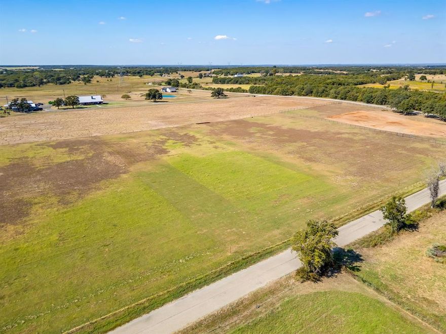 One of four beautiful 2-acre lots available in a row in Poolville, offering a rare opportunity to build your dream home in peaceful Parker County. This corner lot features mature trees and an existing pad site, giving you a valuable head start on construction. The level terrain provides a clean, versatile canvas for your custom build, whether you envision a traditional home or a barndominium. Horses are welcome, allowing you to create the country lifestyle you’ve been dreaming of. Fully fenced. Located outside the city limits, you’ll enjoy fewer restrictions and wide-open space, while still being conveniently positioned just about 30 minutes from Fort Worth and Weatherford. Enjoy the quiet of rural living without sacrificing access to shopping, dining, and major highways. Buy one lot or secure both for additional space and privacy. Opportunities like this are hard to find, come walk the property and start planning your future today. All information is deemed reliable but not guaranteed. All information is deemed reliable but not guaranteed. Buyer and Buyer’s Agent to independently verify all information, including dimensions, acreage, utilities, restrictions, rollback taxes, floodplain status, schools, easements, and mineral rights.