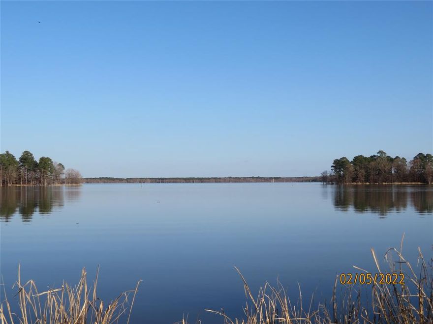 Waterfront lot on beautiful Lake Erling. Just north of Arkansas state line near Springhill, LA. Located in a gated community with HOA, underground electric & sewer tap (One time sewer tap fee.). Cleared & ready for your dream home or just your weekend hide away. No MFG homes. (Photos may be a scenic view of Lake Erling & may not be representative of actual lot.)