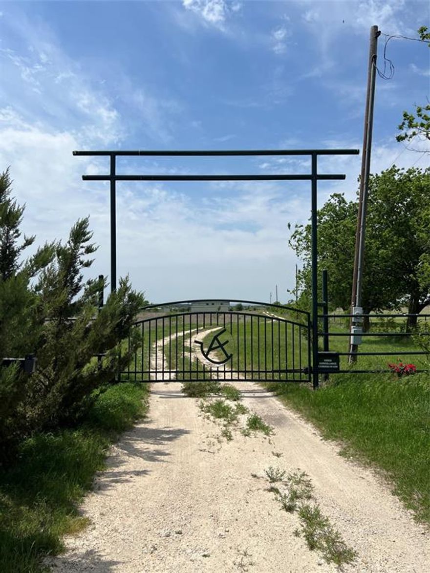 Gorgeous 70+ Acre Country Retreat!! This 70.467-acre property offers privacy, stunning views, and the perfect country living experience, just minutes from Godley. Enter through a private electric gate and enjoy panoramic vistas that stretch across the land, creating an idyllic setting for relaxation or ranching. With a spacious barn featuring nine stalls, a tack room, wash bay, and vet room, this property is ideal for horse lovers. Two paddocks, a round pen, and a walking area provide plenty of space for training and exercise. The lush pastures offer ample grazing space, making it perfect for equestrian operations or a hobby farm. The two-bedroom, 1,100-square-foot living quarters offer a cozy, rustic retreat with stunning views. Whether for weekend getaways or full-time living, the cabin is a peaceful escape, providing a comfortable base to enjoy the surrounding nature.  Although secluded, this property is only minutes from shopping, dining, and the top-rated Godley schools, offering the perfect balance of rural serenity and convenience. With over 70 acres of land, this property offers endless possibilities for a dream home, ranch expansion, or future development, all while maintaining controlled access and privacy.